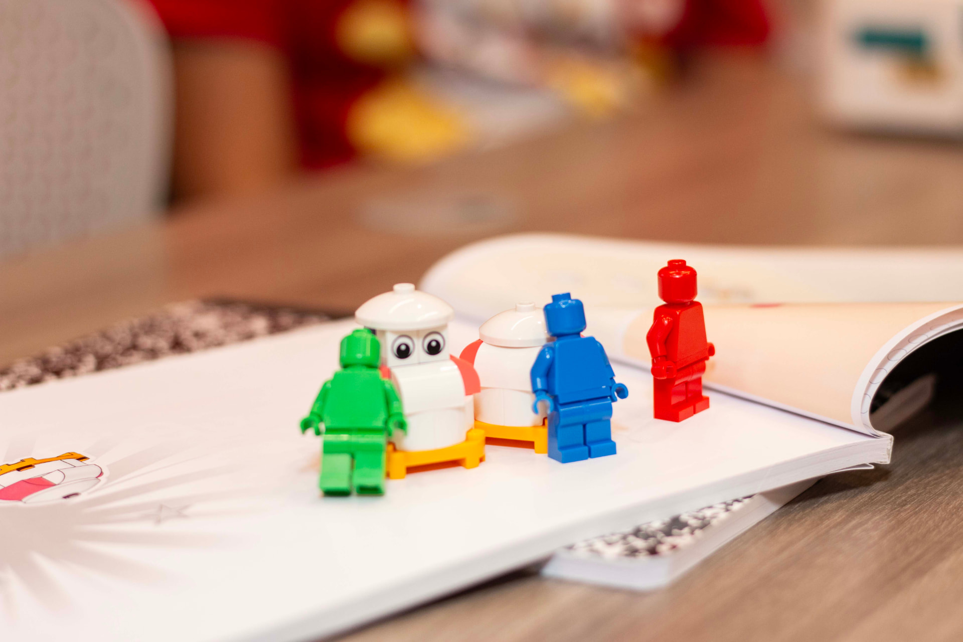 Finished LEGO minifigure science model on a workbook