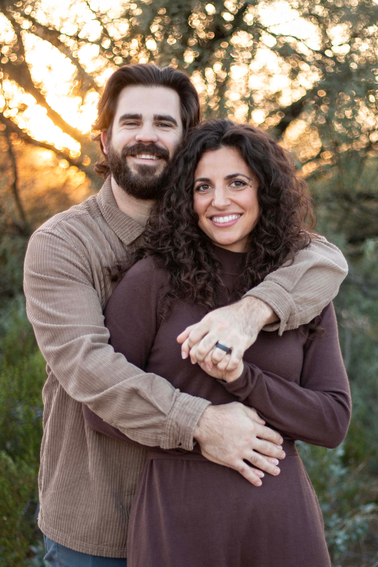 Cortland and Simone Watson, founders of Home Is Our Sanctuary, embracing outdoors at golden hour