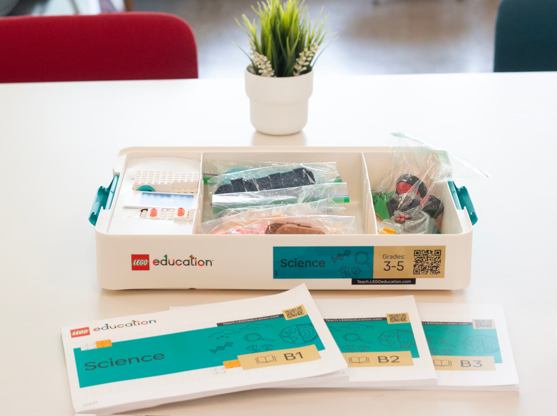 LEGO Education Science kit and student workbooks on a table