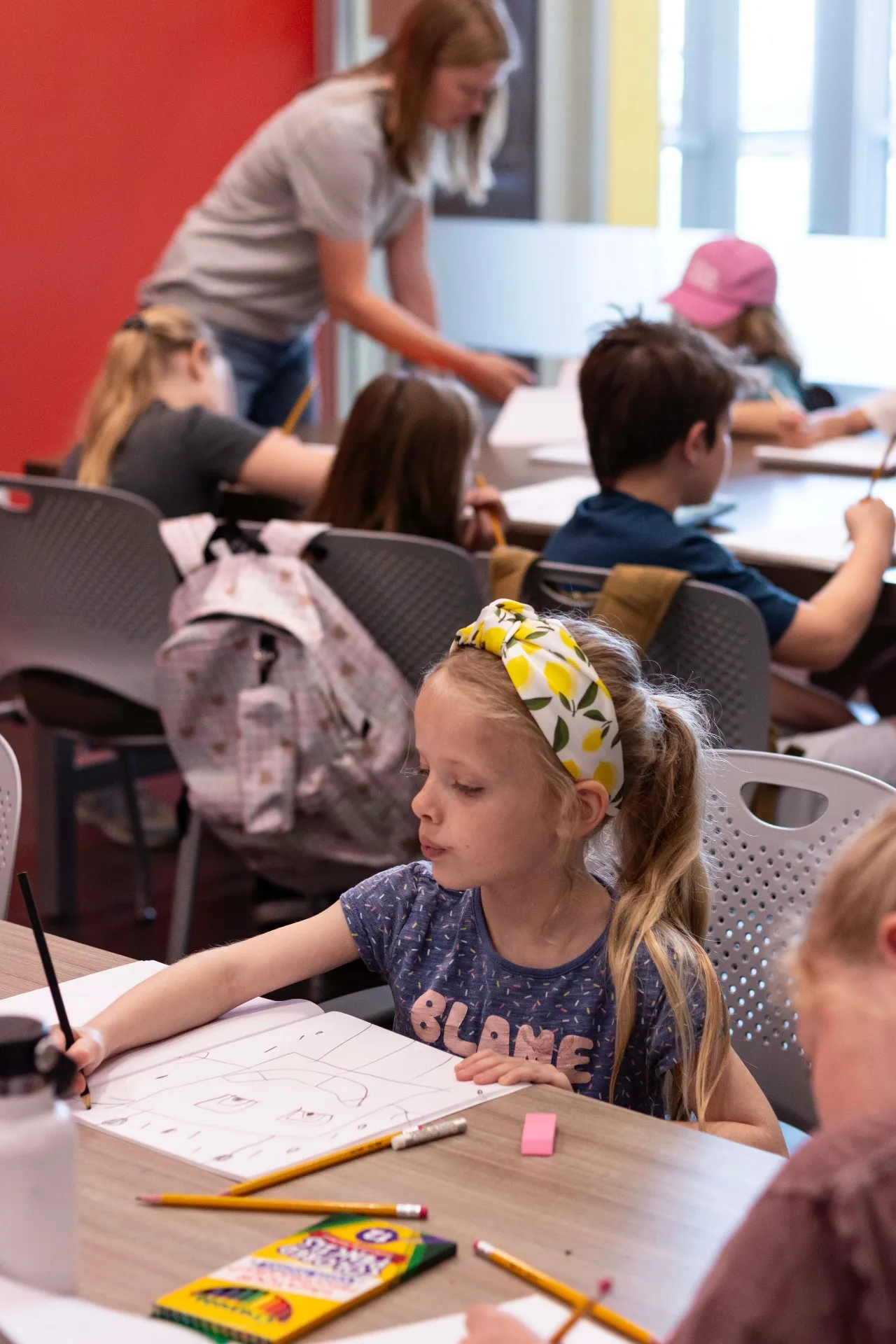 Young artist working on her drawing