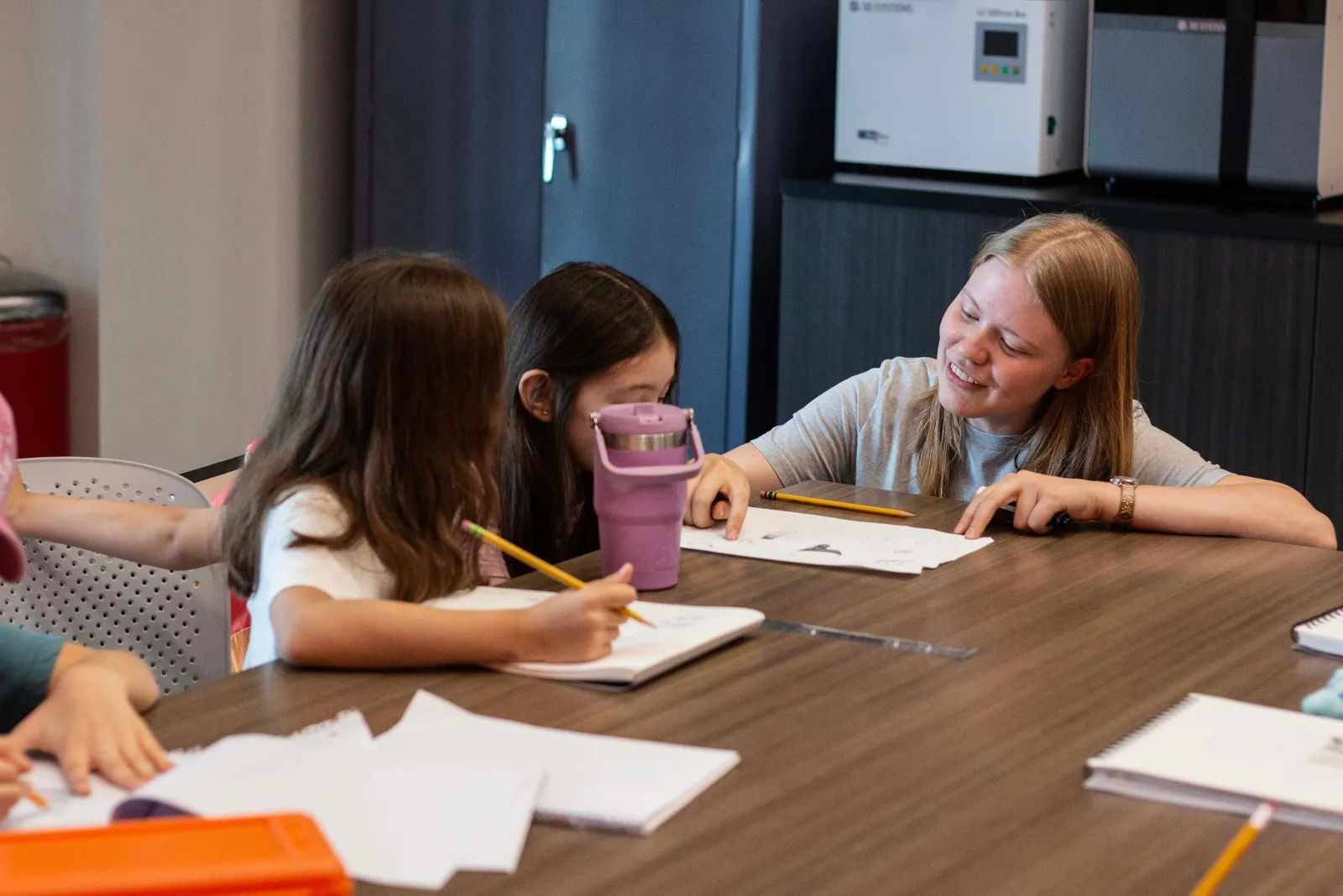 Sanctuary Art Program teacher helping students